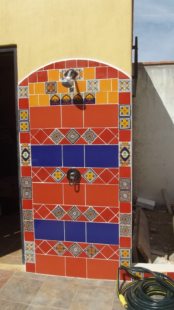 Outside shower with a cacophony of Talavera tile. 